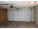 Garage with automatic opener and storage cabinets at 9714 W Edward Dr, Sun City, AZ 85351