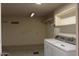 Laundry room with washer, dryer and shelving at 9714 W Edward Dr, Sun City, AZ 85351