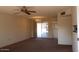 Bright living room with sliding glass doors leading to a patio at 9714 W Edward Dr, Sun City, AZ 85351