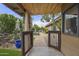 A backyard featuring a lush lawn, outdoor seating, a pool, and mature landscaping at 9837 E Pershing Ave, Scottsdale, AZ 85260