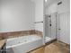 Contemporary bathroom featuring a jacuzzi tub and a glass shower at 9837 E Pershing Ave, Scottsdale, AZ 85260