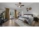 Bright bedroom featuring hardwood floors and a door to the backyard at 9837 E Pershing Ave, Scottsdale, AZ 85260