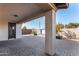 Covered patio with paver stones and water feature at 10012 E Tamery Ave, Mesa, AZ 85212