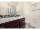 Bathroom with single vanity, shower/tub combo and floral shower curtain at 10012 E Tamery Ave, Mesa, AZ 85212