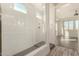 Modern bathroom with a walk-in shower and gray tile floor at 10012 E Tamery Ave, Mesa, AZ 85212