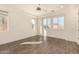 Bright bedroom with wood-look floors, ceiling fan, and window shutters at 10012 E Tamery Ave, Mesa, AZ 85212