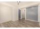 Bright bedroom with wood-look floors and ceiling fan at 10012 E Tamery Ave, Mesa, AZ 85212