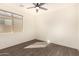 Simple bedroom with wood-look floors and a window at 10012 E Tamery Ave, Mesa, AZ 85212