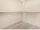 Spacious walk-in closet with wood shelving and ample hanging space at 10012 E Tamery Ave, Mesa, AZ 85212