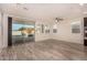 Dining room with sliding glass doors to backyard and wood-look floors at 10012 E Tamery Ave, Mesa, AZ 85212