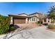 Two-story home with a brown garage door and well-maintained landscaping at 10012 E Tamery Ave, Mesa, AZ 85212
