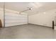 Spacious two-car garage with epoxy flooring and automatic opener at 10012 E Tamery Ave, Mesa, AZ 85212