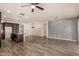 Open living area with wood-look tile floors and ceiling fan at 10012 E Tamery Ave, Mesa, AZ 85212