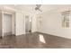 Main bedroom with wood-look floors and access to the bathroom at 10012 E Tamery Ave, Mesa, AZ 85212