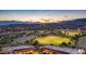 Dusk aerial view of park, shops, and homes at 1022 E Hiddenview Dr, Phoenix, AZ 85048