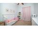 Adorable bedroom featuring a twin bed and pink accents at 1022 E Hiddenview Dr, Phoenix, AZ 85048