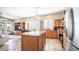 Open kitchen with island, stainless steel appliances, and wood cabinets at 1022 E Hiddenview Dr, Phoenix, AZ 85048