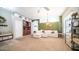 Living room with sectional sofa, built-in shelving, and large windows at 1022 E Hiddenview Dr, Phoenix, AZ 85048