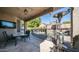 Outdoor patio with seating area, heater, and pool view at 1022 E Hiddenview Dr, Phoenix, AZ 85048