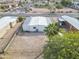 Aerial view of compact home with desert landscaping, fences and neighborhood streets at 104 N 114Th St, Apache Junction, AZ 85120