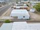 An elevated view of a single-story home with carport and storage, fenced yard, in a park with other homes nearby at 104 N 114Th St, Apache Junction, AZ 85120