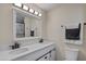 Bathroom featuring double sinks, a well-lit mirror, and modern finishes at 104 N 114Th St, Apache Junction, AZ 85120