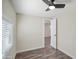 Simple bedroom with a modern ceiling fan, natural light, and wood-look flooring at 104 N 114Th St, Apache Junction, AZ 85120