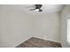 Compact bedroom with a ceiling fan, neutral walls, and wood-look flooring at 104 N 114Th St, Apache Junction, AZ 85120