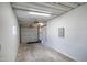 Unfinished garage with door, concrete floor and storage area, providing ample space at 104 N 114Th St, Apache Junction, AZ 85120