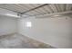 Unfinished garage space featuring concrete floors and a small window for natural light at 104 N 114Th St, Apache Junction, AZ 85120