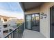 Apartment balcony with sliding glass door and decorative wall art, overlooking desert landscape at 10401 N Saguaro Blvd # 210, Fountain Hills, AZ 85268