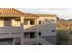 Multi-story apartment building with private balconies and mountain views in the distance at 10401 N Saguaro Blvd # 210, Fountain Hills, AZ 85268