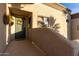 Apartment front door features hanging flower baskets and a decorative wreath at 10401 N Saguaro Blvd # 210, Fountain Hills, AZ 85268