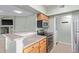 Well-lit kitchen boasts stainless steel appliances, wooden cabinets, and an open layout at 10401 N Saguaro Blvd # 210, Fountain Hills, AZ 85268