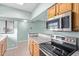 Bright kitchen features modern stainless steel appliances and light wood cabinets at 10401 N Saguaro Blvd # 210, Fountain Hills, AZ 85268