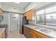 Spacious kitchen features stainless steel appliances, wood cabinets, and a double sink at 10401 N Saguaro Blvd # 210, Fountain Hills, AZ 85268