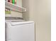 Practical laundry area showcasing a modern washing machine with ample space for detergents and accessories at 10401 N Saguaro Blvd # 210, Fountain Hills, AZ 85268