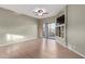 Spacious living room with wood floors, and a built-in media center with large sliding doors at 10401 N Saguaro Blvd # 210, Fountain Hills, AZ 85268