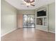 Spacious living room with wood floors, and a built-in media center with large sliding doors at 10401 N Saguaro Blvd # 210, Fountain Hills, AZ 85268