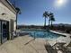 Community pool surrounded by lounge chairs and palm trees, with desert mountain views at 10401 N Saguaro Blvd # 210, Fountain Hills, AZ 85268