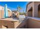 Outdoor kitchen with built-in grill and umbrella at 10582 W Salter Dr, Peoria, AZ 85382