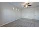 Spacious bedroom with carpet flooring and ceiling fan at 10582 W Salter Dr, Peoria, AZ 85382