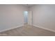 Simple bedroom with carpet and door to additional room at 10582 W Salter Dr, Peoria, AZ 85382