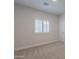 Bright bedroom with window shutters and carpet flooring at 10582 W Salter Dr, Peoria, AZ 85382