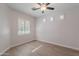 Well-lit bedroom with hardwood floors and window shutters at 10582 W Salter Dr, Peoria, AZ 85382