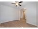 Light and airy bedroom with hardwood floors and arched hallway at 10582 W Salter Dr, Peoria, AZ 85382