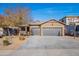 Two-story house with gray garage doors and basketball hoop at 10582 W Salter Dr, Peoria, AZ 85382