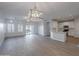 Bright living room with hardwood floors and sliding glass doors at 10582 W Salter Dr, Peoria, AZ 85382