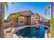 Inviting kidney-shaped pool with a relaxing backyard setting at 10582 W Salter Dr, Peoria, AZ 85382