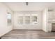 Bright dining room with vinyl flooring and large windows at 11596 W Sierra Dawn Blvd # 5, Surprise, AZ 85378